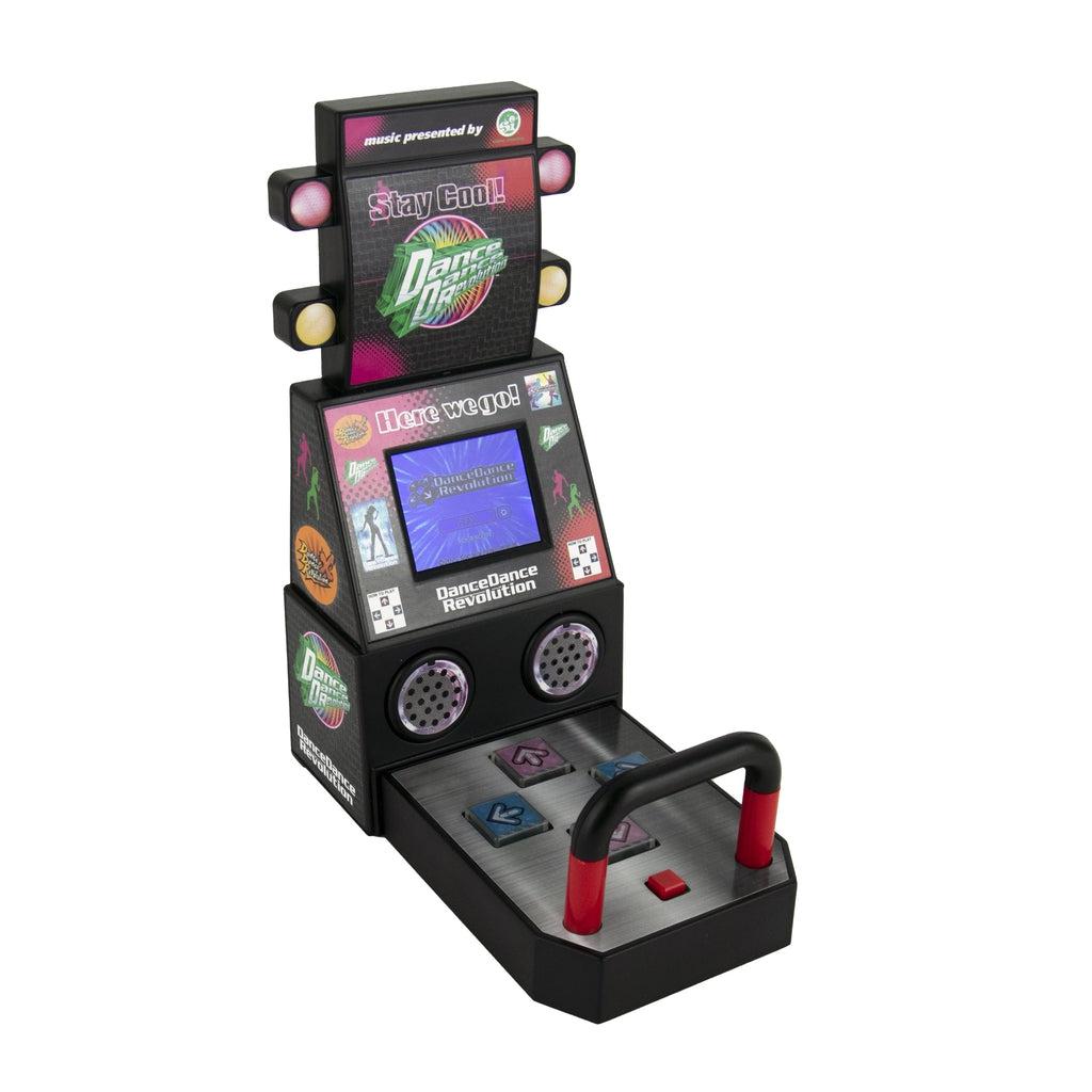 Another angle of the DDR arcade machine. The machine is about the size of two adult hands. It has a bar in the back just like the real/traditional DDR machines.